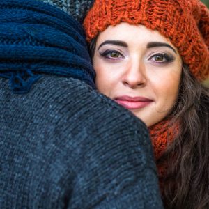 Closeup portrait of a stylish and romantic happy couple at fall in autumn garden